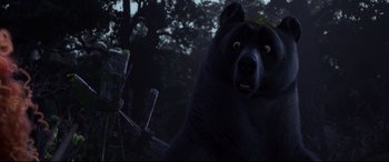 Movie still from “Brave” (2012), directed by Steve Purcell – A black bear is standing in the dark; Close Up shot, Low angle