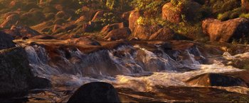 Movie still from “Brave” (2012), directed by Steve Purcell – A river flowing through a lush green forest; Extreme Wide shot, High angle