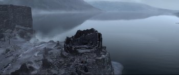Movie still from “Brave” (2012), directed by Steve Purcell – A view of a body of water with a castle on top of it; Extreme Wide shot, High angle