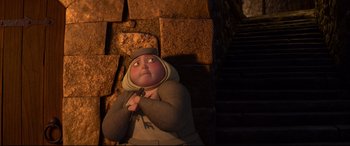 Movie still from “Brave” (2012), directed by Steve Purcell – An animated character is sitting on the stairs; Wide shot, Low angle