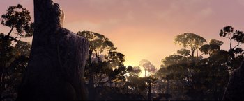 Movie still from “Brave” (2012), directed by Steve Purcell – The sun is setting over a forest filled with trees; Extreme Wide shot, Low angle