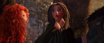 Movie still from “Brave” (2012), directed by Steve Purcell – A woman with long brown hair wearing a black cape; Medium shot, Over the shoulder angle