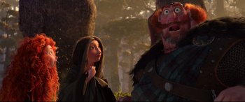 Movie still from “Brave” (2012), directed by Steve Purcell – A couple of people standing next to each other in a forest; Medium shot, Low angle