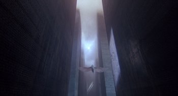 Movie still from “Brazil” (1985), directed by Terry Gilliam – An image of a bird flying through the air; Extreme Wide shot, Low angle