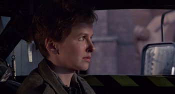 Movie still from “Brazil” (1985), directed by Terry Gilliam – A man sitting in a car looking out the window; Close Up shot, Low angle