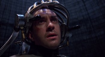 Movie still from “Brazil” (1985), directed by Terry Gilliam – A person with a helmet on; Close Up shot, Low angle
