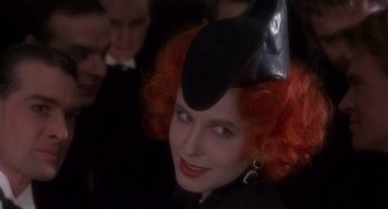 Movie still from “Brazil” (1985), directed by Terry Gilliam – A person wearing a hat; Close Up shot, Over the shoulder angle