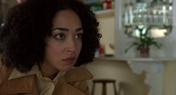 Movie still from “Breakfast on Pluto” (2005), directed by Neil Jordan – A person wearing a jacket; Close Up shot, Over the shoulder angle