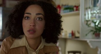 Movie still from “Breakfast on Pluto” (2005), directed by Neil Jordan – A person with curly hair; Close Up shot, High angle