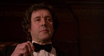 Movie still from “Breakfast on Pluto” (2005), directed by Neil Jordan – A person wearing a bow tie; Close Up shot, Low angle