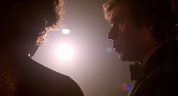 Movie still from “Breakfast on Pluto” (2005), directed by Neil Jordan – A man in a bow tie looking at another man in a bow tie; Close Up shot, Low angle