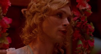 Movie still from “Breakfast on Pluto” (2005), directed by Neil Jordan – A person with curly hair; Close Up shot, Over the shoulder angle