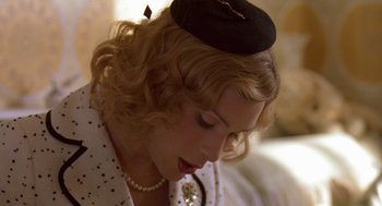 Movie still from “Breakfast on Pluto” (2005), directed by Neil Jordan – A person wearing a hat; Close Up shot, High angle