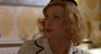 Movie still from “Breakfast on Pluto” (2005), directed by Neil Jordan – A person wearing a hat; Close Up shot, Over the shoulder angle