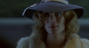 Movie still from “Breakfast on Pluto” (2005), directed by Neil Jordan – A person wearing a hat; Close Up shot, Over the shoulder angle