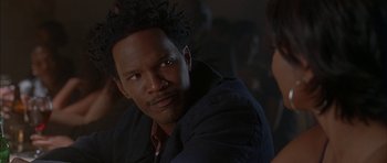 Movie still from “Breakin' All the Rules” (2004), directed by Daniel Taplitz – A person wearing a black jacket; Close Up shot, Over the shoulder angle