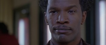 Movie still from “Breakin' All the Rules” (2004), directed by Daniel Taplitz – A man's eyes and face; Close Up shot, Low angle