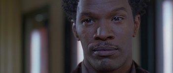 Movie still from “Breakin' All the Rules” (2004), directed by Daniel Taplitz – A man's eyes and face; Close Up shot, Low angle