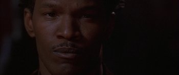Movie still from “Breakin' All the Rules” (2004), directed by Daniel Taplitz – A man's face in the dark; Close Up shot, Low angle