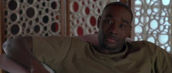 Movie still from “Breakin' All the Rules” (2004), directed by Daniel Taplitz – A person sitting in a chair; Close Up shot, High angle