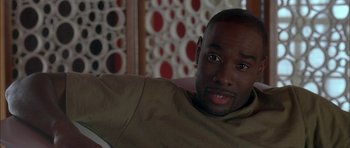 Movie still from “Breakin' All the Rules” (2004), directed by Daniel Taplitz – A person sitting on a couch; Close Up shot, High angle