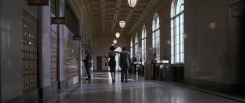 Movie still from “Breakin' All the Rules” (2004), directed by Daniel Taplitz – Two women are walking in a large hallway; Extreme Wide shot, Low angle