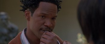 Movie still from “Breakin' All the Rules” (2004), directed by Daniel Taplitz – A person holding his hand to his mouth; Close Up shot, High angle