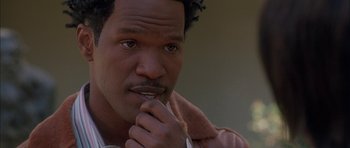 Movie still from “Breakin' All the Rules” (2004), directed by Daniel Taplitz – A person with his hand under his chin; Close Up shot, High angle