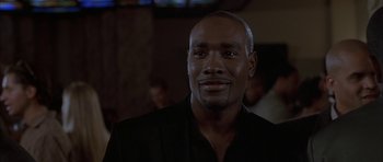 Movie still from “Breakin' All the Rules” (2004), directed by Daniel Taplitz – A person wearing a suit; Close Up shot, Over the shoulder angle