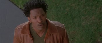Movie still from “Breakin' All the Rules” (2004), directed by Daniel Taplitz – A person wearing a brown jacket; Close Up shot, High angle
