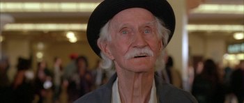 Movie still from “Breakin' All the Rules” (2004), directed by Daniel Taplitz – An old man with a black hat and white beard; Close Up shot, Low angle