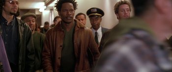Movie still from “Breakin' All the Rules” (2004), directed by Daniel Taplitz – A group of people walking down a hall way; Medium shot, Over the shoulder angle
