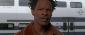 Movie still from “Breakin' All the Rules” (2004), directed by Daniel Taplitz – A person wearing a brown jacket; Close Up shot, Low angle