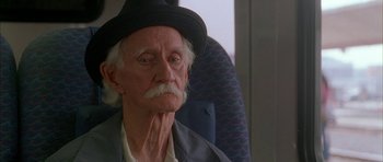 Movie still from “Breakin' All the Rules” (2004), directed by Daniel Taplitz – An old man with a mustache wearing a black hat; Close Up shot, Low angle
