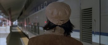 Movie still from “Breakin' All the Rules” (2004), directed by Daniel Taplitz – A person wearing a hat and a brown jacket; Close Up shot, Overhead angle