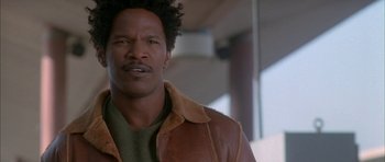 Movie still from “Breakin' All the Rules” (2004), directed by Daniel Taplitz – A person wearing a leather jacket; Close Up shot, Low angle