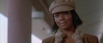 Movie still from “Breakin' All the Rules” (2004), directed by Daniel Taplitz – A person wearing a hat; Close Up shot, Low angle