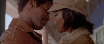 Movie still from “Breakin' All the Rules” (2004), directed by Daniel Taplitz – A man and a woman face to face in front of each other; Close Up shot, Low angle