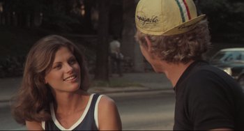 Movie still from “Breaking Away” (1979), directed by Peter Yates – A man and a woman talking on the side of the road; Close Up shot, Over the shoulder angle