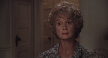 Movie still from “Breaking Away” (1979), directed by Peter Yates – An older woman is looking into the distance; Close Up shot, Over the shoulder angle