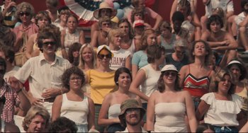 Movie still from “Breaking Away” (1979), directed by Peter Yates – A group of people sitting in a stadium; Medium shot, High angle