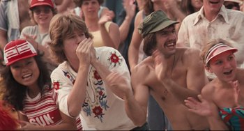 Movie still from “Breaking Away” (1979), directed by Peter Yates – Two young men are laughing and having fun together; Medium shot, High angle