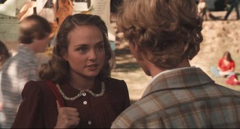 Movie still from “Breaking Away” (1979), directed by Peter Yates – A young woman talking to an older man in front of a building; Close Up shot, Over the shoulder angle