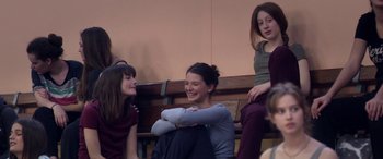 Movie still from “Breathe” (2014), directed by Mélanie Laurent – A group of women sitting on a bench; Medium shot, Over the shoulder angle