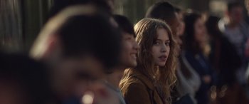 Movie still from “Breathe” (2014), directed by Mélanie Laurent – A group of young people sitting in a row; Close Up shot, Over the shoulder angle