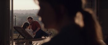 Movie still from “Breathe” (2014), directed by Mélanie Laurent – A man sitting on the ground in front of another man; Extreme Wide shot, Over the shoulder angle