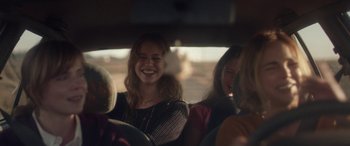 Movie still from “Breathe” (2014), directed by Mélanie Laurent – A group of people sitting in the back of a car; Medium shot, Over the shoulder angle