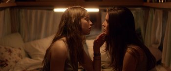 Movie still from “Breathe” (2014), directed by Mélanie Laurent – Two young women looking at each other in a mirror; Close Up shot, Over the shoulder angle