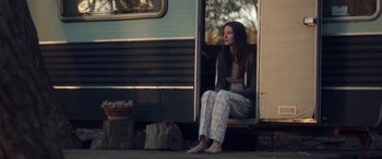 Movie still from “Breathe” (2014), directed by Mélanie Laurent – A woman sitting on the steps of a train; Wide shot, Low angle