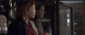 Movie still from “Breathe” (2014), directed by Mélanie Laurent – Two young women sitting next to each other in a room; Close Up shot, Over the shoulder angle